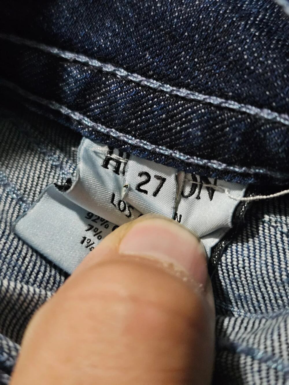 Dark wash denim jeans with contrast stitching five pocket zip fly